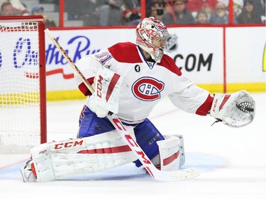 Carey Price of the Montreal Canadiens makes the save against the Ottawa Senators during second period of NHL action at Canadian Tire Centre in Ottawa, April 26, 2015.