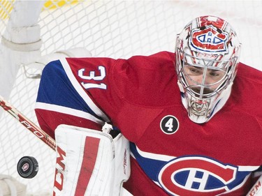 Montreal Canadiens goaltender Carey Price makes a save against the Ottawa Swnators during first period of Game 5 NHL first round playoff hockey action in Montreal, Friday, April 24, 2015.