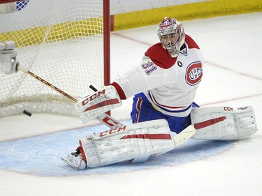Montreal Canadiens' Carey Price (31) makes a save against Ottawa Senators' Kyle Turris (7) (not shown) during the first period of an NHL Stanley Cup playoff hockey game, Sunday April 26, 2015, in Ottawa.