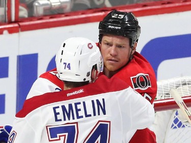 Chris Neil of the Ottawa Senators battles Alexei Emelin of the Montreal Canadiens during first period action.