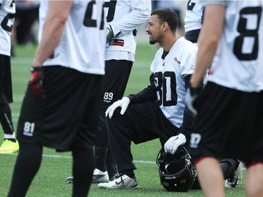 Chris Williams (80) takes a knee during practice at TD Place.