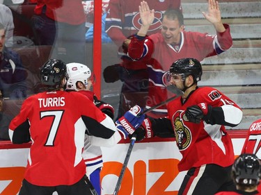 Clarke MacArthur of the Ottawa Senators hits Brendan Gallagher of the Montreal Canadiens during first period action.