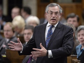 Treasury Board President Tony Clement answers a question during Question Period in the House of Commons on Parliament Hill in Ottawa, Tuesday, April 21, 2015.