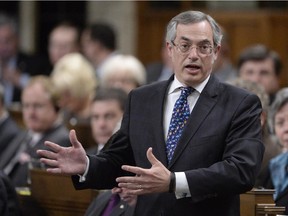 Treasury Board President Tony Clement answers a question during Question Period in the House of Commons on Parliament Hill in Ottawa, Tuesday, April 21, 2015.