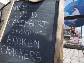 'Cold camembert served with broken crackers' reads the sign outside of the Foolish Chicken restaurant in Ottawa on April 2, in reference to the now infamous statement from Conservative Senator Nancy Ruth.