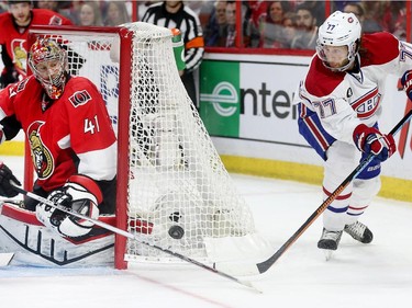 Craig Anderson keeps his eye on the puck passed out from behind the net by Tom Gilbert in the second period as the Ottawa Senators take on the Montreal Canadiens at the Canadian Tire Centre in Ottawa for Game 6 of the NHL Eastern Conference playoffs on Sunday evening.