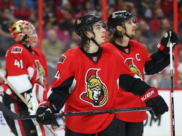 Craig Anderson (L), Jean-Gabriel Pageau and Erik Karlsson of the Ottawa Senators look up at the replay after Craig Anderson lost his edge in the corner against the Montreal Canadiens during first period of NHL action at Canadian Tire Centre in Ottawa, April 26, 2015.  (Jean Levac/ Ottawa Citizen)