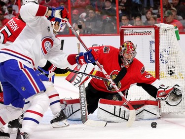 Craig Anderson makes a stop in the second period as the Montreal Canadiens and the Ottawa Senators play game 3 of the first round playoffs at Canadian Tire Centre. Assignment - 120361 Photo taken at 20:26 on April 19. (Wayne Cuddington / Ottawa Citizen)