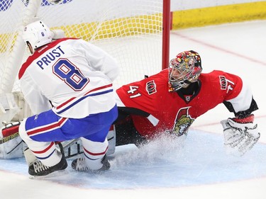 Craig Anderson of the Ottawa Senators makes the great save on Brandon Prust of the Montreal Canadiens during second period action.