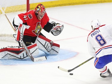 Craig Anderson of the Ottawa Senators makes the great save on Brandon Prust of the Montreal Canadiens during second period action.