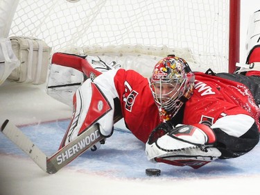 Craig Anderson of the Ottawa Senators makes the great save on Brandon Prust of the Montreal Canadiens during second period action.