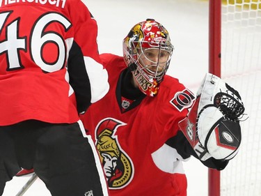 Craig Anderson of the Ottawa Senators makes the save against the Montreal Canadiens during first period action at Canadian Tire Centre in Ottawa, April 19, 2015.
