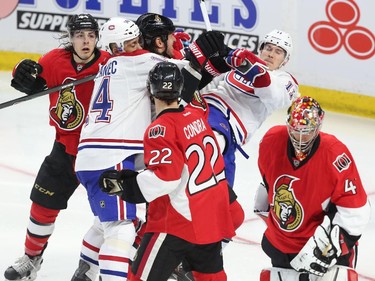 Craig Anderson of the Ottawa Senators skates away from a battle opposing Marc Methot and Brendan Gallagher of the Montreal Canadiens during third period action at Canadian Tire Centre in Ottawa, April 19, 2015.  (Jean Levac/ Ottawa Citizen)