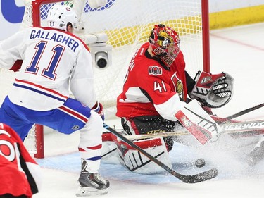 Craig Anderson (R) of the Ottawa Senators makes the save on Brendan Gallagher of the Montreal Canadiens.