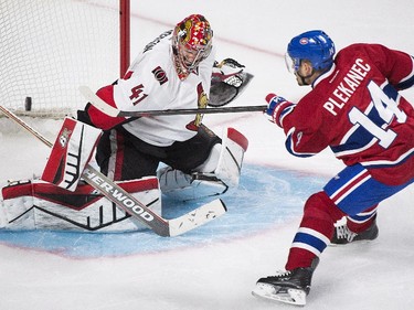 Ottawa Senators goaltender Craig Anderson makes a save on the Canadiens' Tomas Plekanec in Montreal on Friday, April 24, 2015.