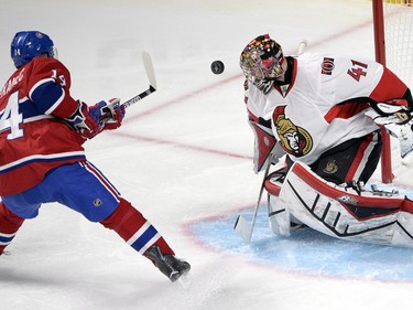 Ottawa Senators goalie Craig Anderson (41) stops Montreal Canadiens center Tomas Plekanec (14) during second period of Game 5 NHL first round playoff hockey action Friday, April 24, 2015 in Montreal.