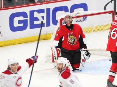 Craig Anderson (top) of the Ottawa Senators looks on dejected as Dale Weise(L) of the Montreal Canadiens celebrates his game winning goal with Brandon Prust at Canadian Tire Centre in Ottawa, April 19, 2015.  (Jean Levac/ Ottawa Citizen)