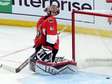 Ottawa Senators goalie Craig Anderson reacts after Montreal Canadiens forward Dale Weise's game-winning goal slipped past him in sudden death overtime of game 3 of first round Stanley Cup NHL playoff hockey action in Ottawa on Sunday, April 19, 2015. The Canadiens defeated the Senators 2-1.