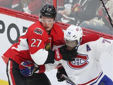 Curtis Lazar of the Ottawa Senators battles against P.K. Subban of the Montreal Canadiens during first period action.