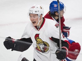 Ottawa Senators' Curtis Lazar celebrates a goal by teammate Patrick Wiercioch against the Montreal Canadiens during first period of Game 5 NHL first round playoff hockey action in Montreal, Friday, April 24, 2015.