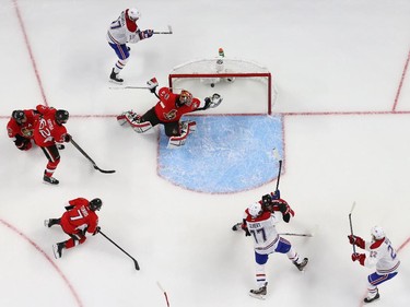 Dale Weise (22) of the Montreal Canadiens ties the game 1-1 as Craig Anderson of the Ottawa Senators was helpless during third period action at Canadian Tire Centre in Ottawa, April 19, 2015.