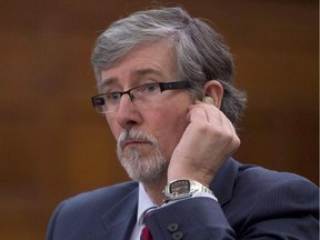 Privacy Commissioner Daniel Therrien waits to appear at the Commons science and technology committee to discuss the Digital Privacy Act, on Parliament Hill in Ottawa, Tuesday February 17, 2015. Therrien says Bell should seek customer consent to track their Internet, TV and phone call use to deliver targeted online advertising.