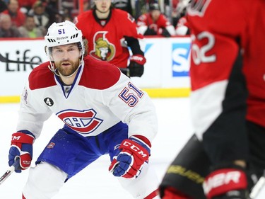 David Desharnais of the Montreal Canadiens battles against the Ottawa Senators during first period of NHL action at Canadian Tire Centre in Ottawa, April 26, 2015.