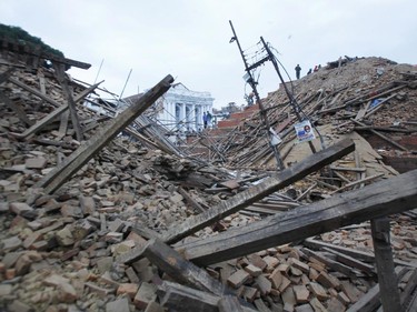 Debris lie at Durbar Square after an earthquake in Kathmandu, Nepal, Saturday, April 25, 2015. A strong magnitude-7.9 earthquake shook Nepal's capital and the densely populated Kathmandu Valley before noon Saturday, causing extensive damage with toppled walls and collapsed buildings, officials said.