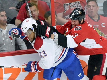 Ottawa Senators defenceman Marc Methot (3) hits Montreal Canadiens forward Devante Smith-Pelley (21) during the second period of game 3.