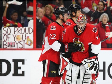Erik Condra and Craig Anderson (R) of the Ottawa Senators show their dejection after losing their series against the Montreal Canadiens during third period of NHL action at Canadian Tire Centre in Ottawa, April 26, 2015.