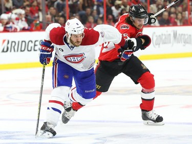 Erik Karlsson of the Ottawa Senators gets tangled with Brandon Prust of the Montreal Canadiens during second period of NHL action at Canadian Tire Centre in Ottawa, April 26, 2015.
