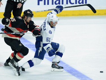Ottawa Senators' Erik Karlsson chases after Tampa Bay Lightning's Valtteri Filppula as he gets a break-away during first period NHL action.