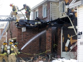 Firefighters battle blaze at a home on Peacock Cres. in Barrhaven on Friday morning.