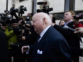 Former Conservative senator Mike Duffy arrives at Ottawa Court House as the first day of his trial begins on Tuesday, April 7, 2015. (James Park / Ottawa Citizen)