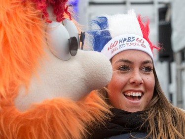 Former Expo mascot Youppie cuddles with a Habs fan at the Fan Jam 2015 as the Ottawa Senators get set to take on the Montreal Canadiens at the Bell Centre in Montreal for Game 5 of the NHL Conference playoffs on Friday evening.