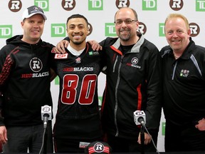 Former Hamilton Tiger Cats wide Receiver/kick returner, Chris Williams, was signed to the Ottawa Redblacks Tuesday during a press conference at TD Place with Redblacks Head Coach Rick Campbell (left), GM Marcel Desjardins (centre right) and owner, Jeff Hunt (far right). (Julie Oliver / Ottawa Citizen)