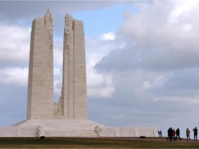 Visitors look at the memorial of the historic site of the Crete de Vimy where Canadian troops took up positions during World War I, in Vimy, on February 23, 2014.