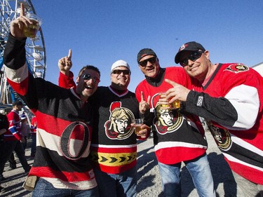 From left, Fernando Medeiros, Mike Medeiros, Jason Thompson and Mano Dellavedova show their Sens spirit during FanJam 2015 prior to the start of game one between the Montreal Canadiens and Ottawa Senators in Montreal Wednesday April 15, 2015.
