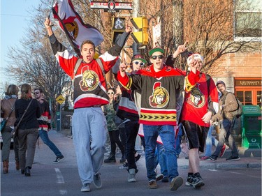 (from left) Nicholas Lowe, Scott Hanson, Ian Medaglia, Aaron Lambert, and hidden from view Jason Chambers chant Go Sens Go as hockey fans head to the Sensmile on Elgin Street to watch the Ottawa Senators take on the Montreal Canadiens on television in game 1 of the playoffs.