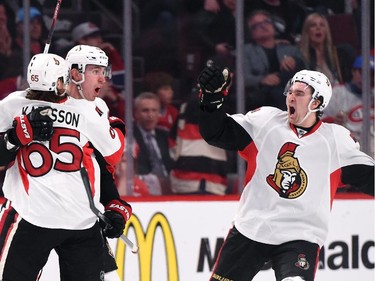 Patrick Wiercioch #46 and Erik Karlsson #65 of Ottawa Senators celebrate after scoring a goal against the Montreal Canadiens  in Game Two of the Eastern Conference Quarterfinals during the 2015 NHL Stanley Cup Playoffs at the Bell Centre on April 17, 2015 in Montreal, Quebec, Canada.