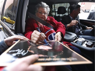 Ginette Reno signs autographs as she arrives at the Bell Centre where she'll sing the national anthem before game two between the Montreal Canadiens and the Ottawa Senators at the Bell Centre in Montreal Friday April 17, 2015.