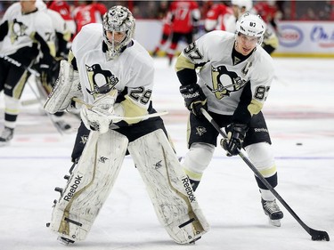 Goalie Marc-Andre Fleury, left, and Sidney Crosby in the warmup skate.
