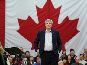 Prime Minister Stephen Harper delivers a speech to supporters at a high school in Ottawa, Sunday, January 25, 2015.