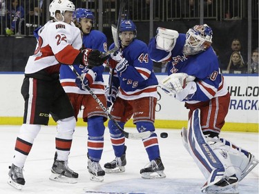 New York Rangers goalie Henrik Lundqvist (30) defends a shot by Ottawa Senators right wing Erik Condra (22) during the third period.