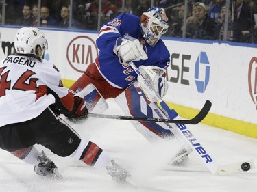 New York Rangers goalie Henrik Lundqvist (30) defends the net against Ottawa Senators center Jean-Gabriel Pageau (44) during the first period.