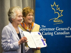 Her Excellency, Mrs. Sharon Johnson, right, presents the Governor General's Caring Canadian award to recipient Inge Schrader.