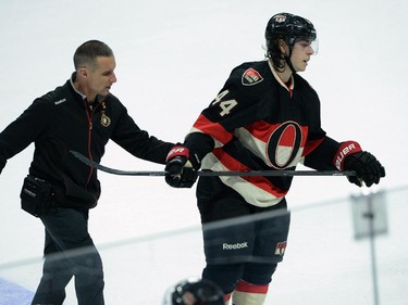 Ottawa Senators' Jean-Gabriel Pageau is helped off the ice after taking a centre ice hit to the lower body against the Tampa Bay Lightning in second period NHL action.