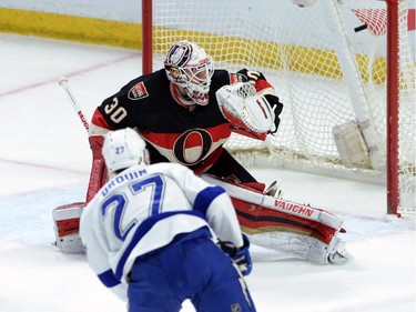 Tampa Bay Lightning Jonathan Drouin slams a shot past Ottawa Senators' Andrew Hammond during first period NHL action.