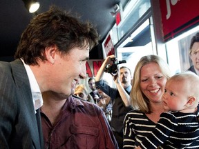 Federal Liberal leader Justin Trudeau, left, greets supporters with candidate Adam Vaughan at a rally for the Trinity-Spadina riding while attending during a campaign stop in Toronto on Thursday, May 22, 2014.