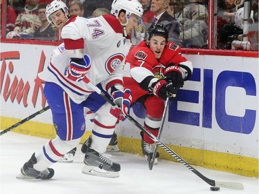 Kyle Turris and Alexei Emelin (L) battle for the puck in the first period as the Ottawa Senators take on the Montreal Canadiens at the Canadian Tire Centre in Ottawa for Game 6 of the NHL Eastern Conference playoffs on Sunday evening.